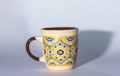 Close-up of coffee cup on table