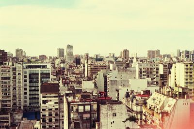 High angle view of buildings in city against sky