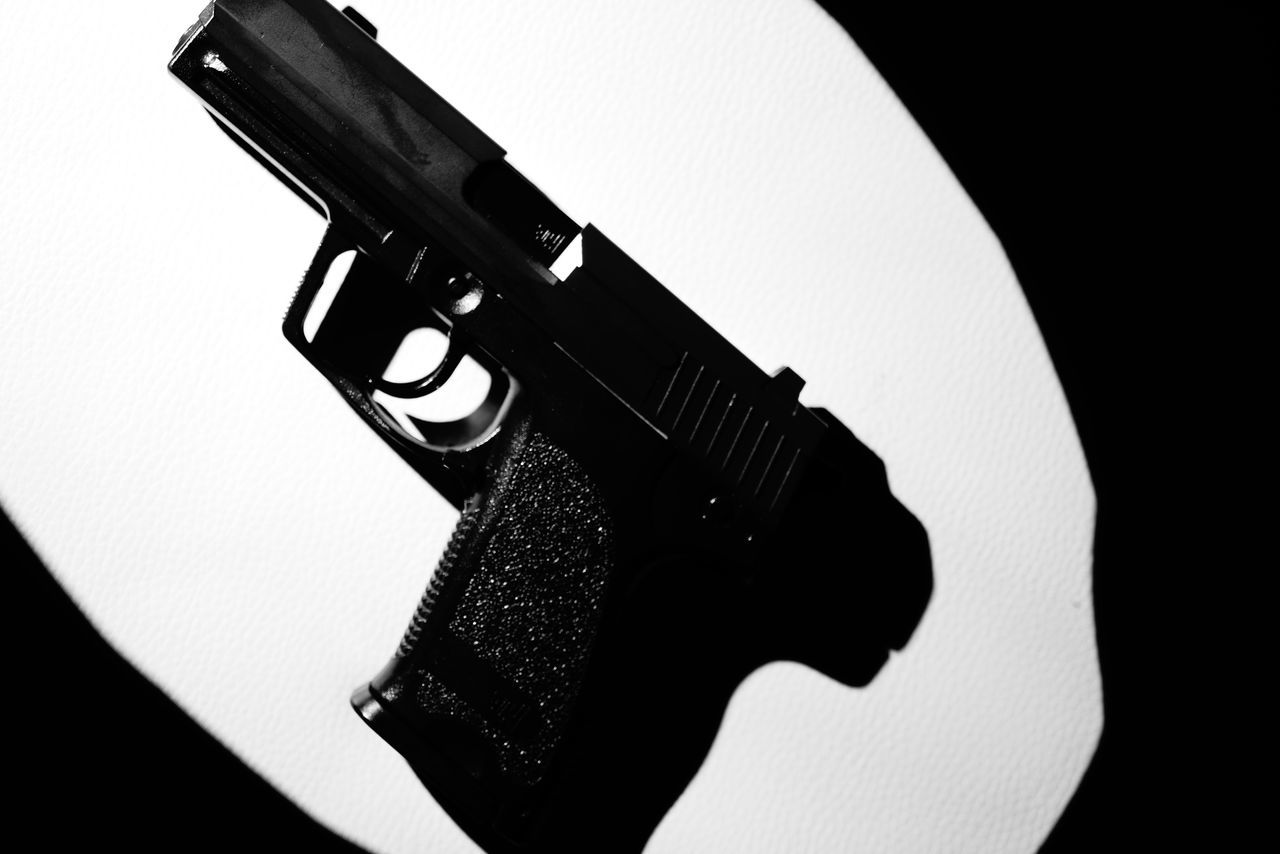 weapon, handgun, gun, black, revolver, indoors, hand, violence, firearm, close-up, warning sign, aggression, studio shot, gun barrel, black and white, arm, crime