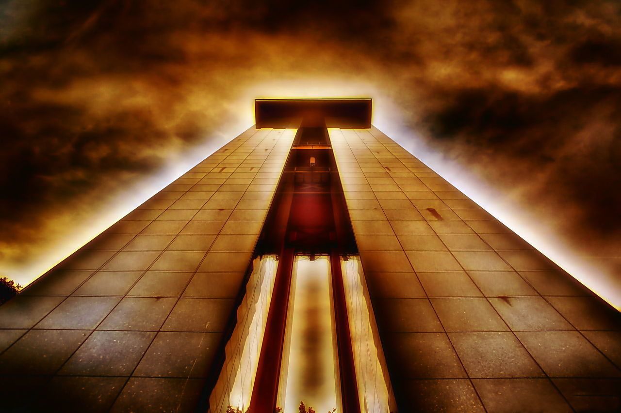 LOW ANGLE VIEW OF ILLUMINATED BUILDING AGAINST SKY