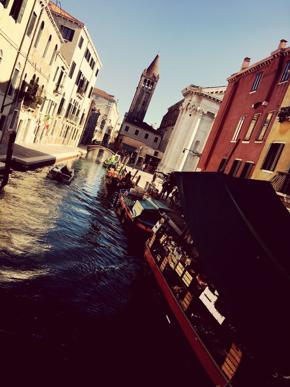 building exterior, architecture, built structure, canal, water, day, outdoors, nautical vessel, large group of people, city, real people, sky, people