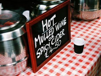 High angle view of sign on wine stall