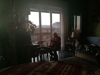 Man sitting on chair at home