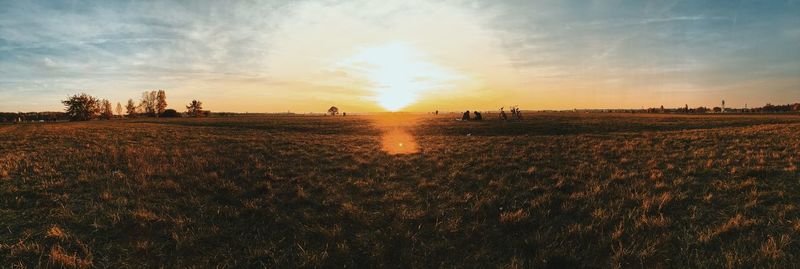 Scenic view of landscape at sunset