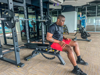 Low section of man exercising in gym