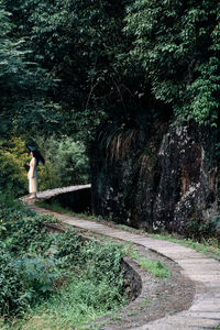 Rear view of man walking on field