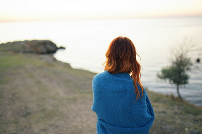 Rear view of woman looking at sea