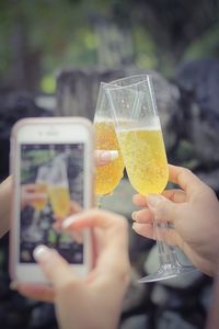 Close-up of woman holding wine glass