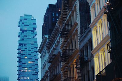 Low angle view of buildings in city against sky