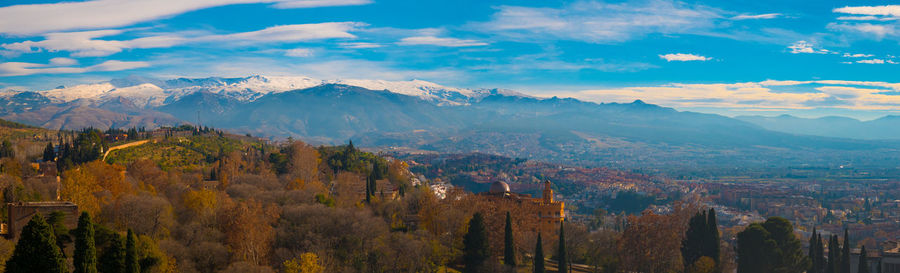 Panoramic view of granada city with sierra nevada in background .