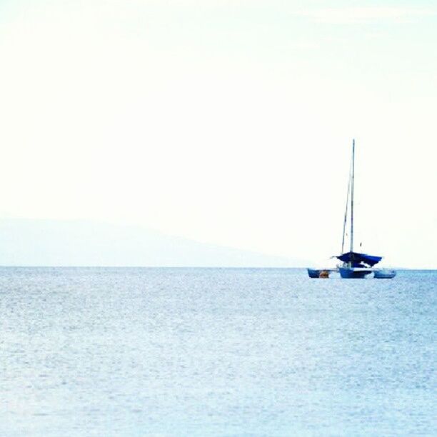 sea, horizon over water, water, nautical vessel, transportation, copy space, waterfront, tranquil scene, clear sky, tranquility, boat, mode of transport, scenics, beauty in nature, nature, seascape, sky, rippled, idyllic, day