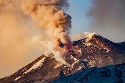 Smoke emitting from volcanic mountain