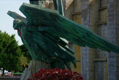 Low angle view of statue against building