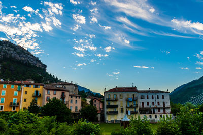 Buildings in town against sky