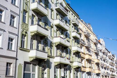 Low angle view of building against clear blue sky