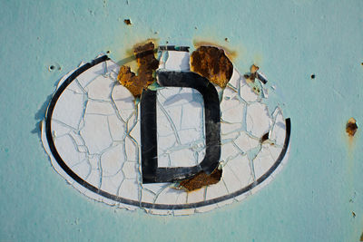 Close-up of letter d on wall