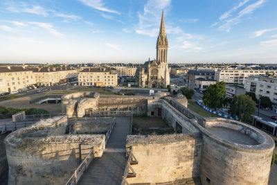 High angle view of city buildings against sky