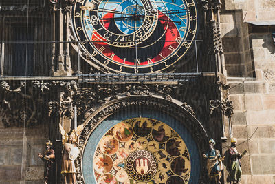 Low angle view of clock tower in city