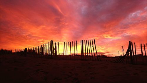 Scenic view of beach against sky during sunset