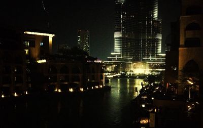 Buildings in city at night