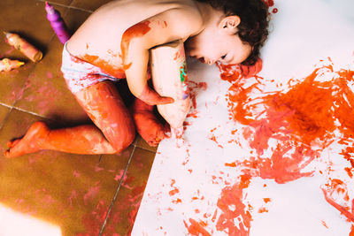 High angle view of cute girl relaxing on floor