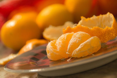 Close-up of oranges in plate