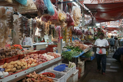 People at market stall