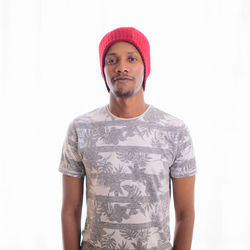 Portrait of mid adult man against white background