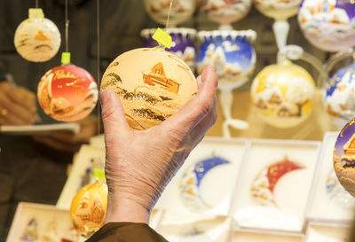 Close-up of hand holding painting