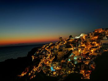 Aerial view of illuminated city at night