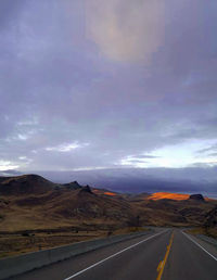 Empty country road along rocky landscape