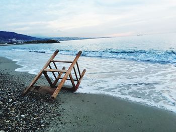 Scenic view of sea against cloudy sky