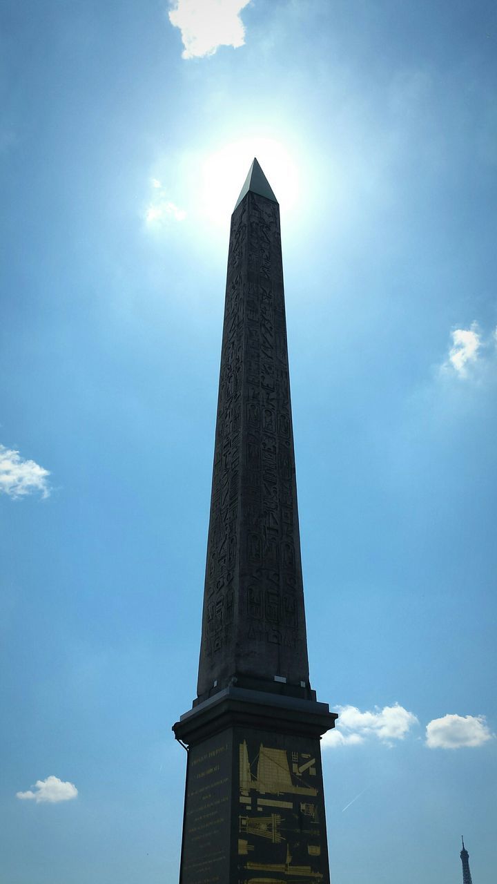 low angle view, architecture, built structure, sky, tower, building exterior, cloud - sky, tall - high, history, cloud, famous place, blue, travel destinations, travel, international landmark, day, outdoors, tourism, no people, cloudy