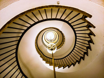 Directly below shot of spiral staircase in building