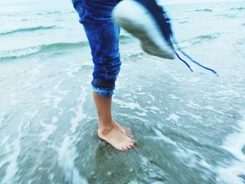 Low section of man in sea