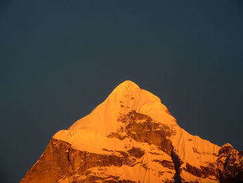 Low angle view of mountain against sky at night