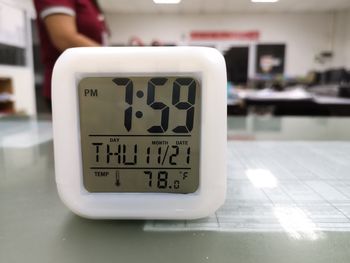 Close-up of clock on table