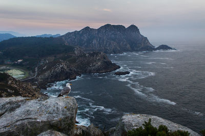 Scenic view of sea against cloudy sky