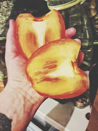 Close-up of hand holding fruit