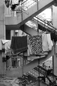 Clothes drying on railing against poor construction 