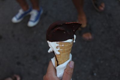 Hand holding ice cream cone