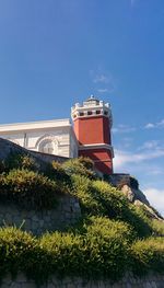 Low angle view of built structure against blue sky