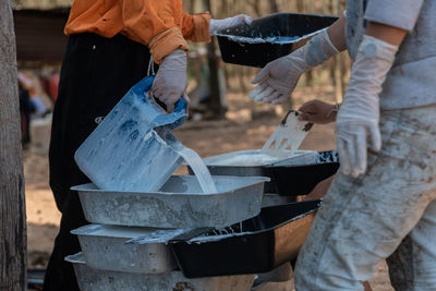 Low section of people working on wood