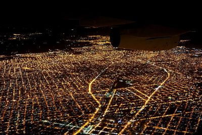 Aerial view of illuminated city at night