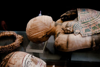 Close-up of shells on table against black background