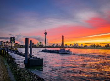 Scenic view of bridge over river against sky during sunset