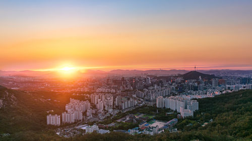 High angle view of townscape against sky during sunset