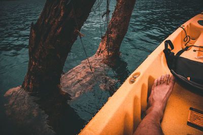 Low section of man in boat on lake