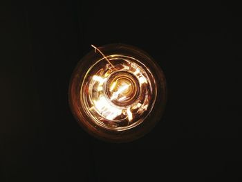 Low angle view of illuminated light bulb