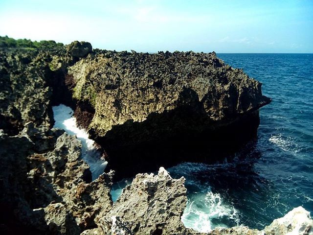 water, sea, rock formation, rock - object, scenics, beauty in nature, rock, tranquility, tranquil scene, cliff, nature, horizon over water, geology, rocky, eroded, idyllic, blue, rough, clear sky, sky